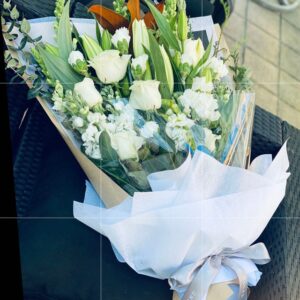 Flat back funeral flower arrangement size 600hx400w