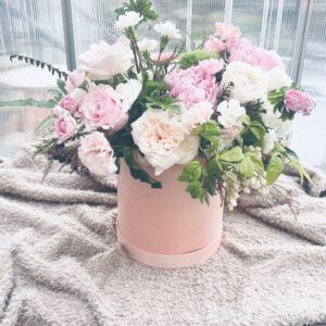 Luxury seasoning pink flower arrangement in paper bucket