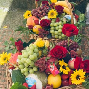 One seasoning choice fruit and flower arrangement in bamboo basket