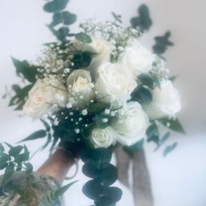 Rose , babyâ€™s breath and gum leave bridal Bouquet