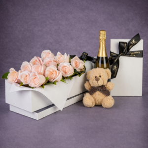 Elegant Gift Display with Roses and Wine –