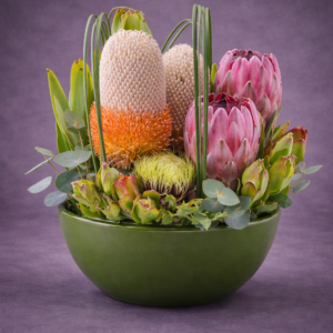 Exotic Floral Arrangement in Green Bowl –