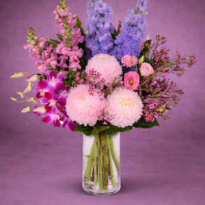 Vibrant Floral Arrangement in Clear Vase –
